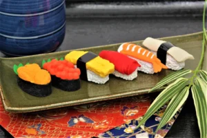 Assorted sushi pieces on a decorative plate