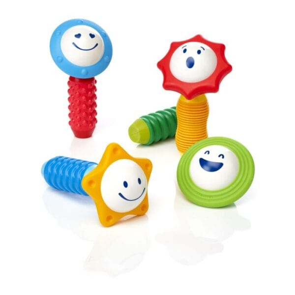 Colorful baby rattles with smiling faces