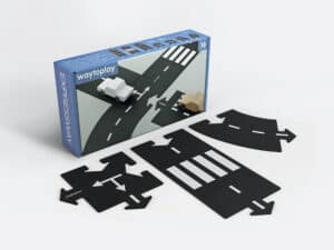Toy road set with customizable pieces and cars