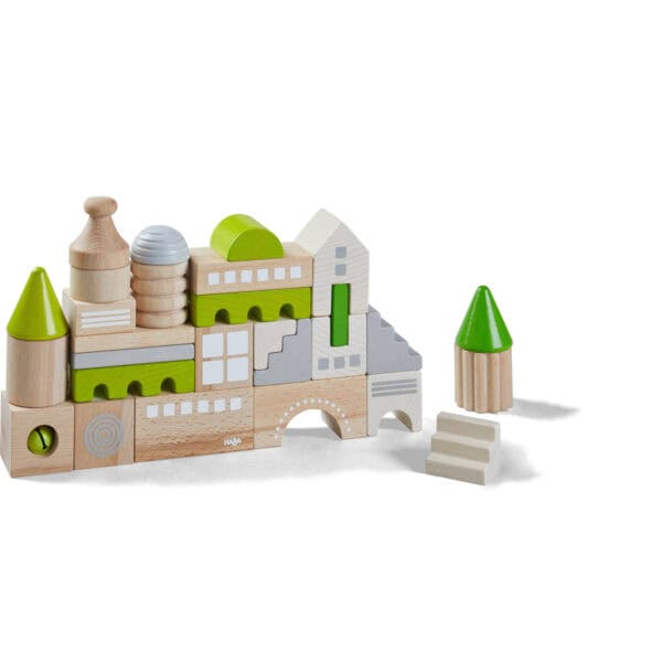 Wooden city building blocks with green accents.