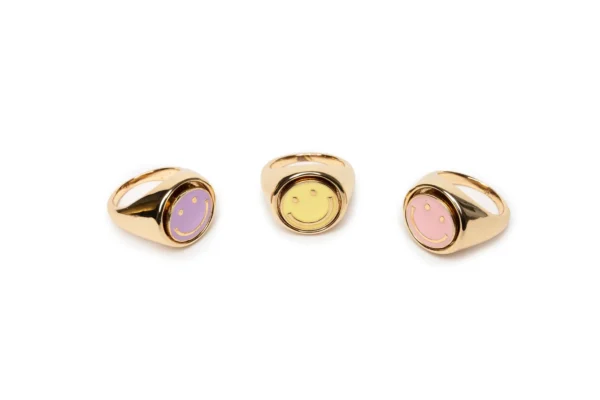 Gold rings with colorful smiley faces.
