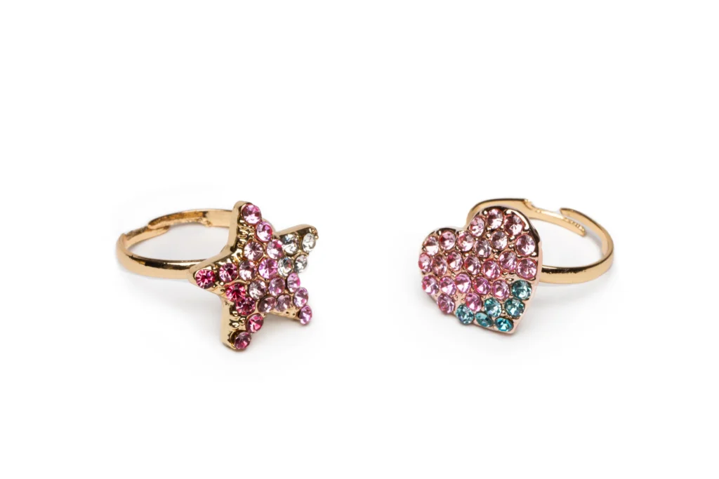 Gold rings, star and heart shapes, jeweled design.