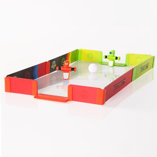 Mini tabletop soccer game with colorful robots and ball.