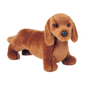 Brown plush dachshund toy on white background.