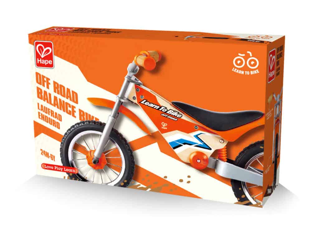 Orange off-road balance bike for toddlers, Hape brand.