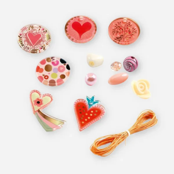 Colorful craft accessories with hearts and string.