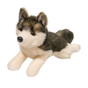 Fluffy stuffed husky plush toy laying down.