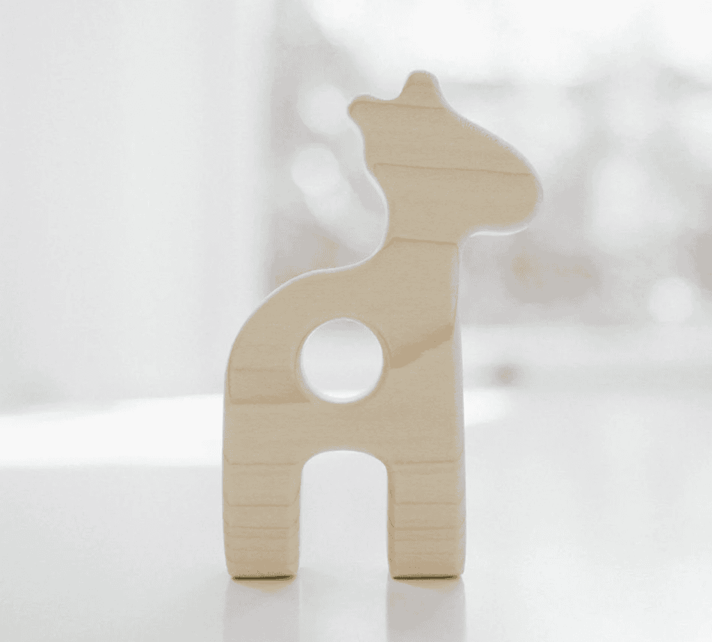 Wooden giraffe toy with heart cutout