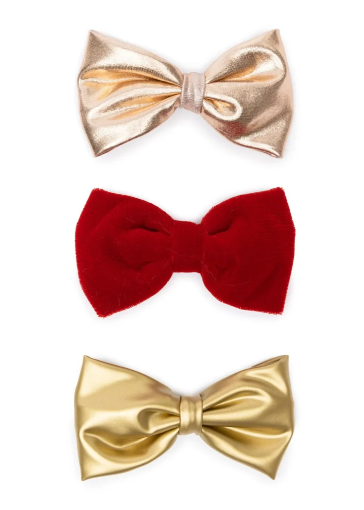 Three metallic and velvet bow ties in gold, red.
