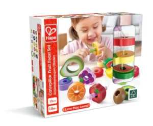 Child playing with wooden fruit toy set.