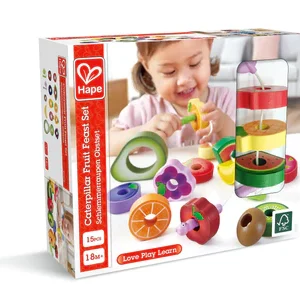 Child playing with wooden fruit toy set.