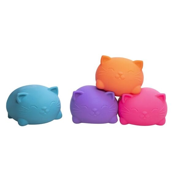 Colorful squishy cat toys stacked together.
