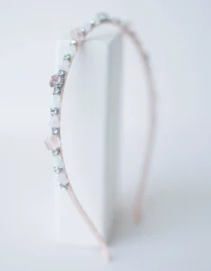 Elegant bejeweled headband on white background.