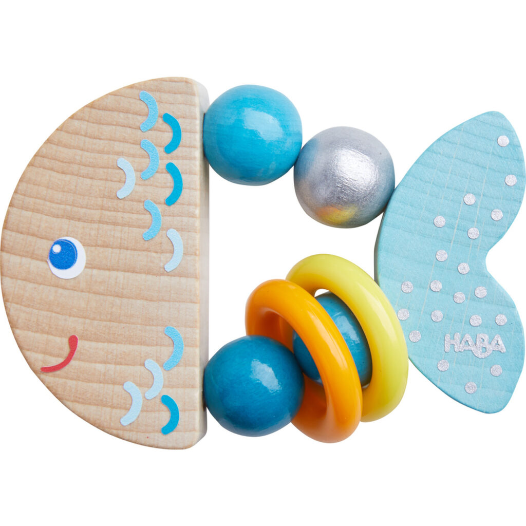 Colorful fish-shaped wooden baby toy by HABA.