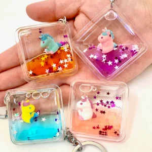 Colorful unicorn liquid keychains with stars.