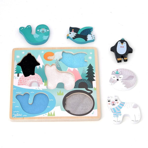 Polar animal puzzle pieces on board