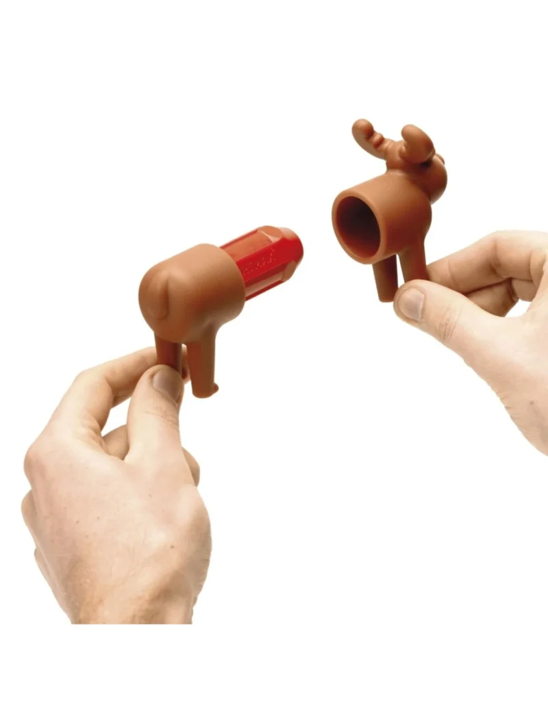 Hands holding reindeer-shaped chocolate molds.