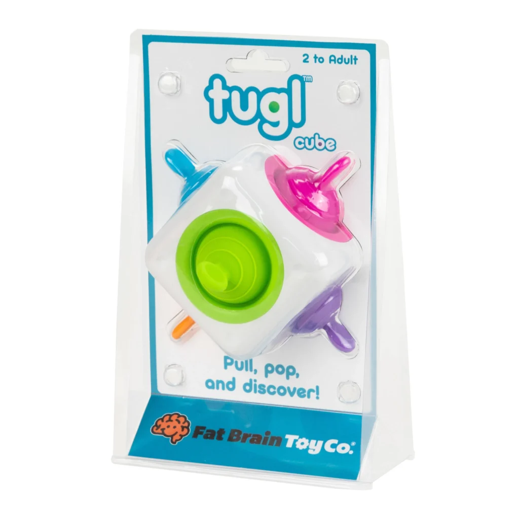 Tuggl Cube toy in packaging, colorful interactive design.
