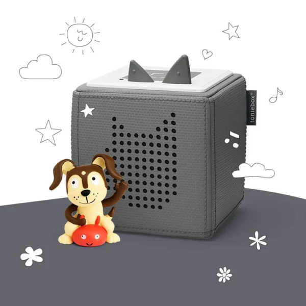 Gray speaker box and dog figurine.