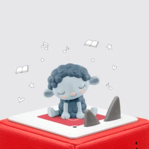 Gray sheep figurine on red speaker device.