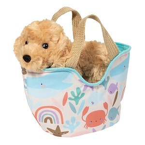 Plush puppy in colorful patterned tote bag.
