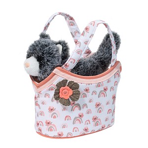 Stuffed animal in decorative fabric basket with handles.