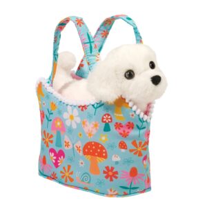 Plush puppy toy in colorful floral bag.