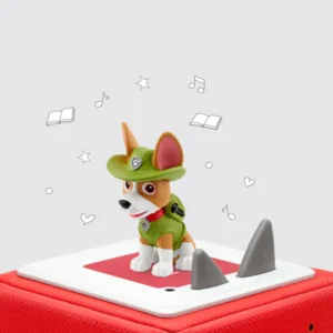 Toy dog figurine on speaker box