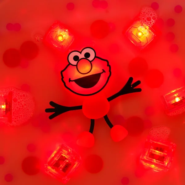Glowing Elmo toy surrounded by illuminated cubes