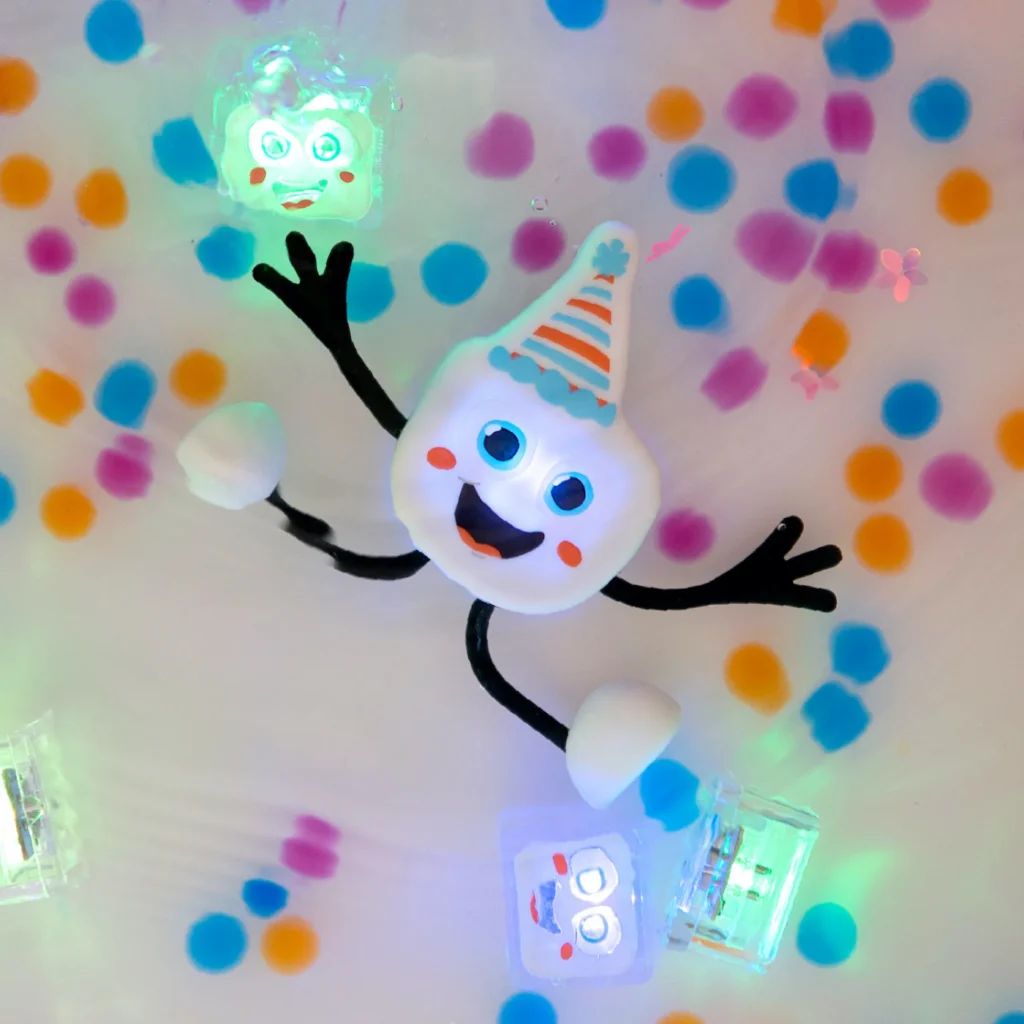 Happy cartoon marshmallow with party hat and confetti