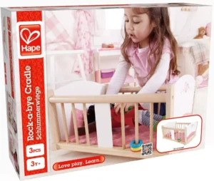 Hape Rock-a-bye Cradle toy packaging with child.
