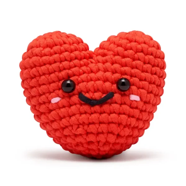 Smiling crocheted heart plush toy