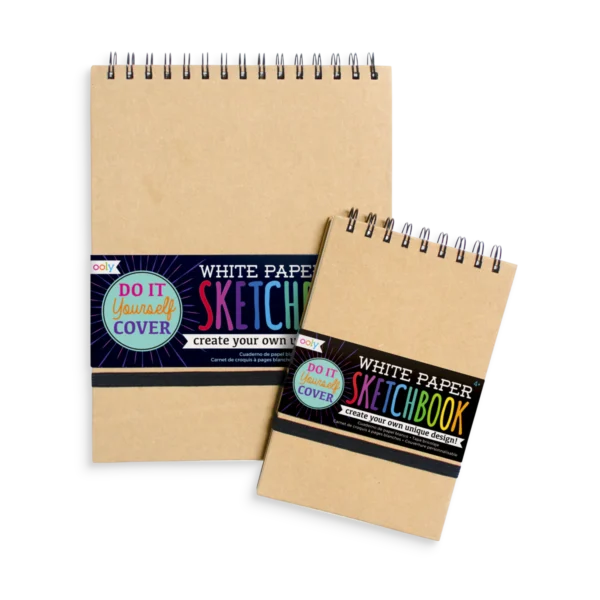 DIY sketchbooks with spiral binding and white paper.