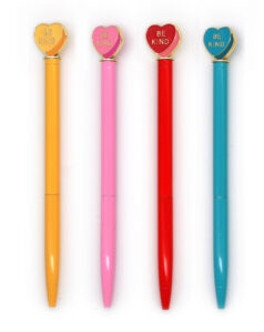 Four colorful pens with 'Be Kind' hearts.