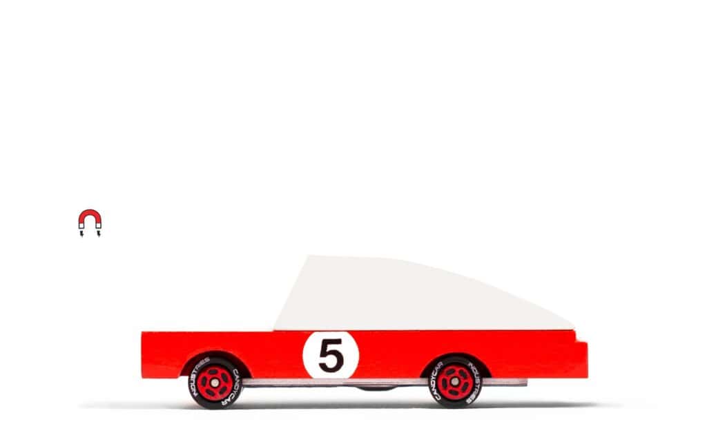 Red toy race car with magnetic feature.
