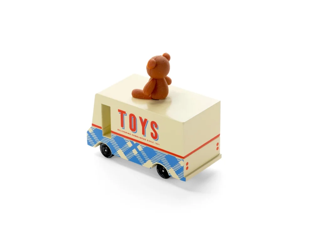 Toy truck with teddy bear on top