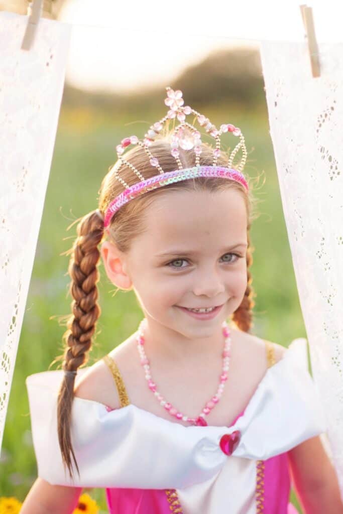 Smiling child in princess costume and tiara