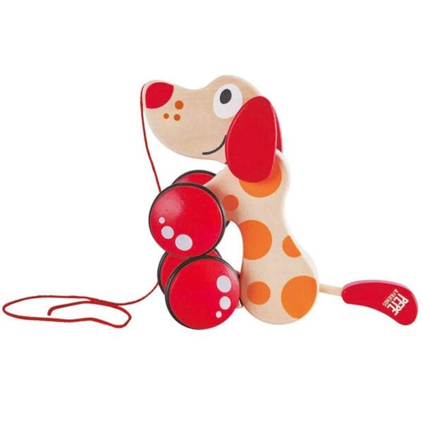 Wooden pull toy dog with red wheels