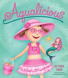 Girl in pink with tiny mermaid, Aqualicious book cover.