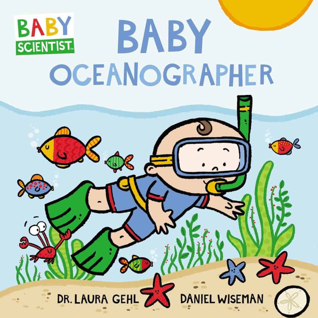 Baby underwater exploring with fish and sea creatures.