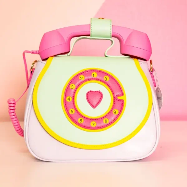 Retro telephone-shaped handbag with colorful design.