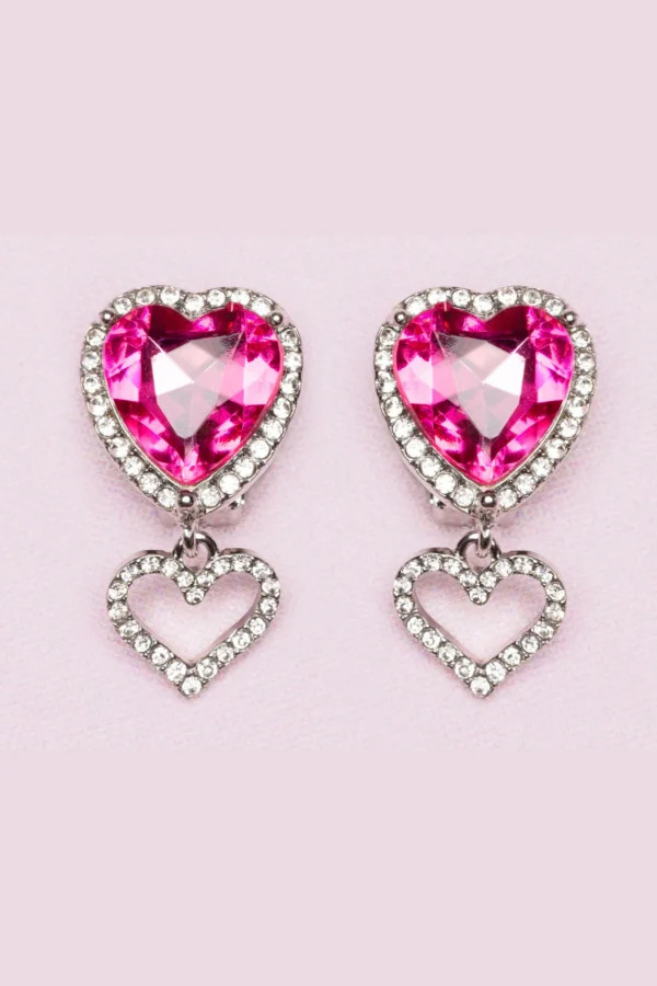 Pink heart-shaped crystal earrings with diamond accents.