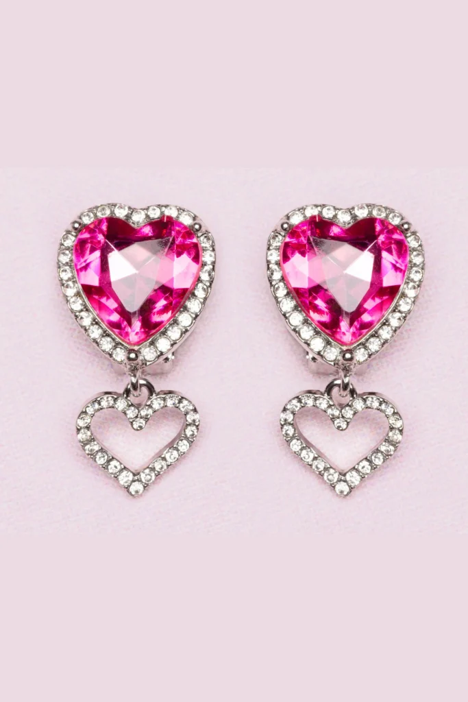Pink heart-shaped crystal earrings with diamond accents.