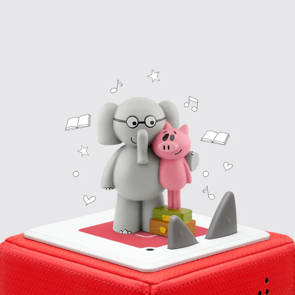 Elephant and pig toy figures on red speaker