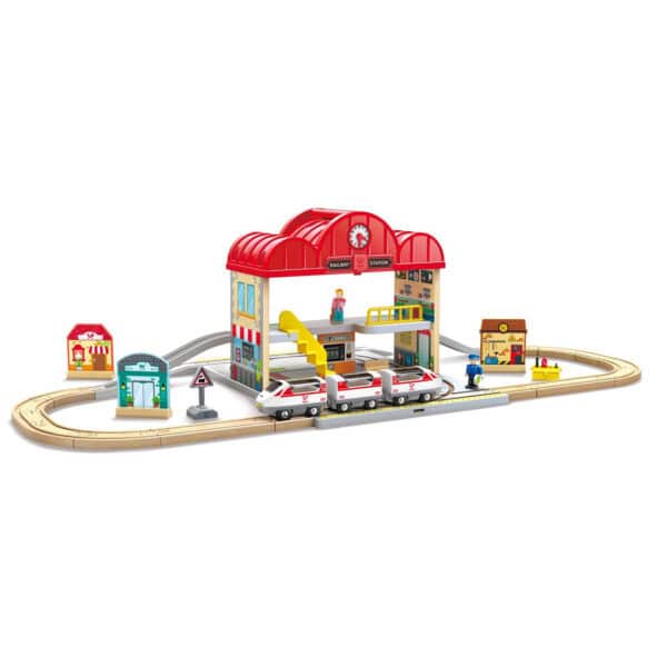 Wooden toy train set with station and tracks.