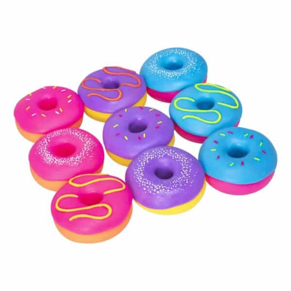 Colorful assorted toy donuts arranged in a pattern.