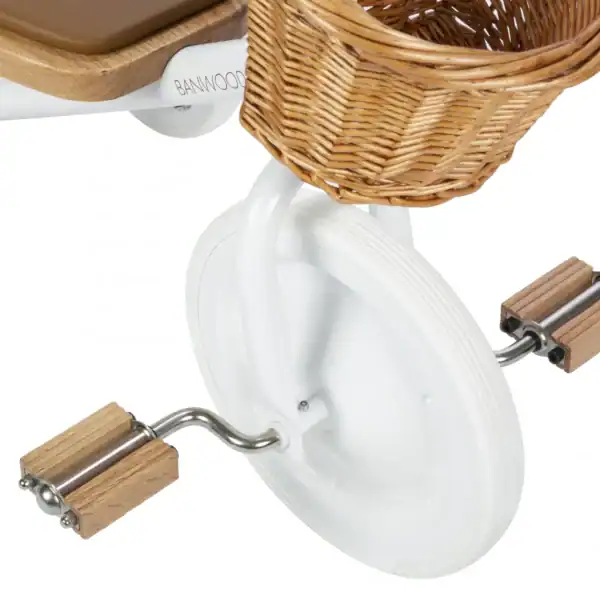 Child's tricycle with basket and wooden pedals.
