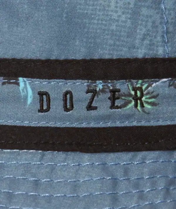 Close-up of a blue Dozer hat label.