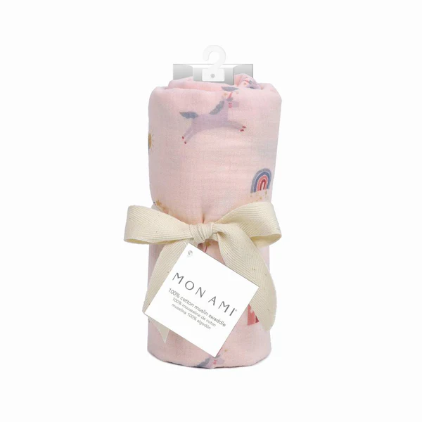 Pink baby swaddle blanket with ribbon and label.