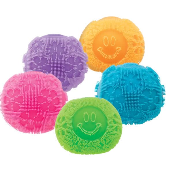 Colorful scrub brushes with smiley faces.